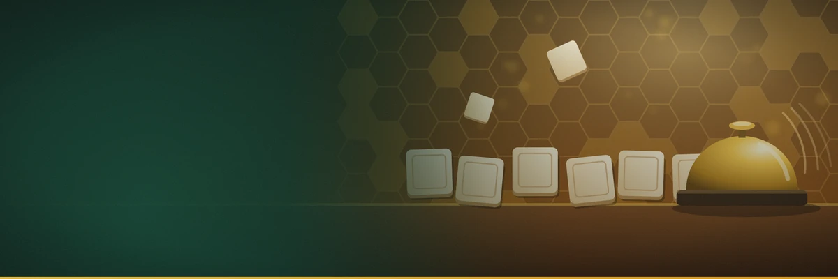 A row of blank wooden letter tiles and a gold desk bell on a table against a honeycomb pattern