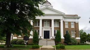 The Dallas County Courthouse in Fordyce, Arkansas, a brick building with a white columned portico and a small dome