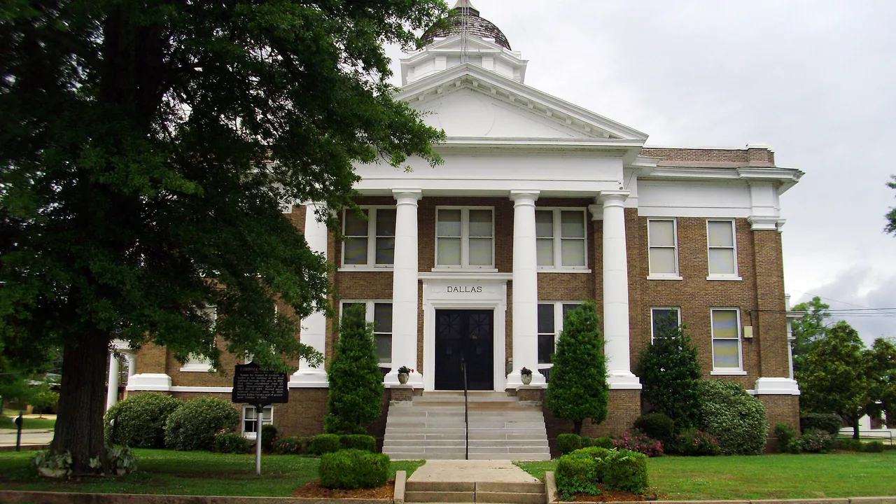 The Dallas County Courthouse in Fordyce, Arkansas, a brick building with a white columned portico and a small dome