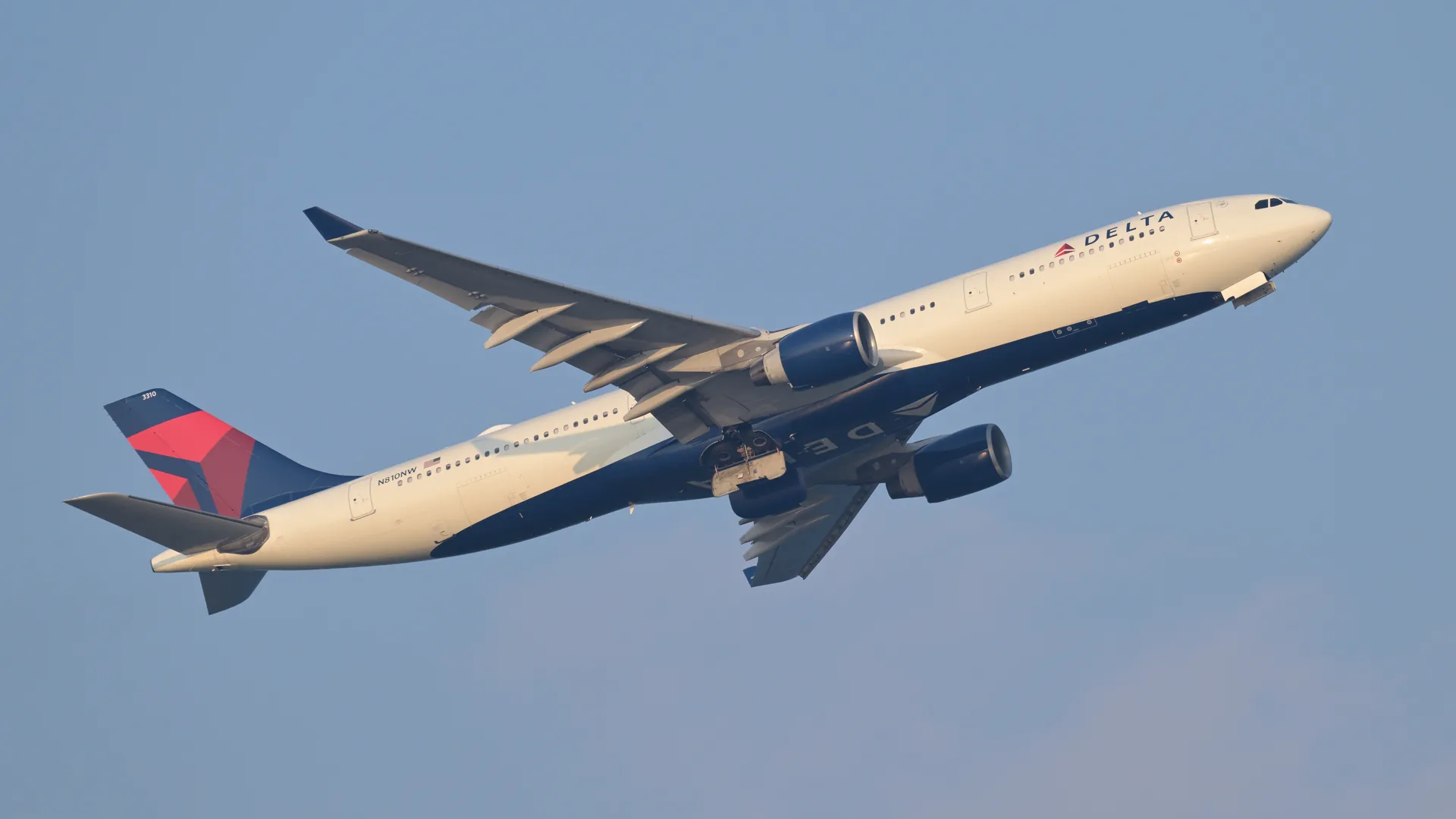 Delta Air Lines Airbus A330-300 climbing after takeoff from Boston