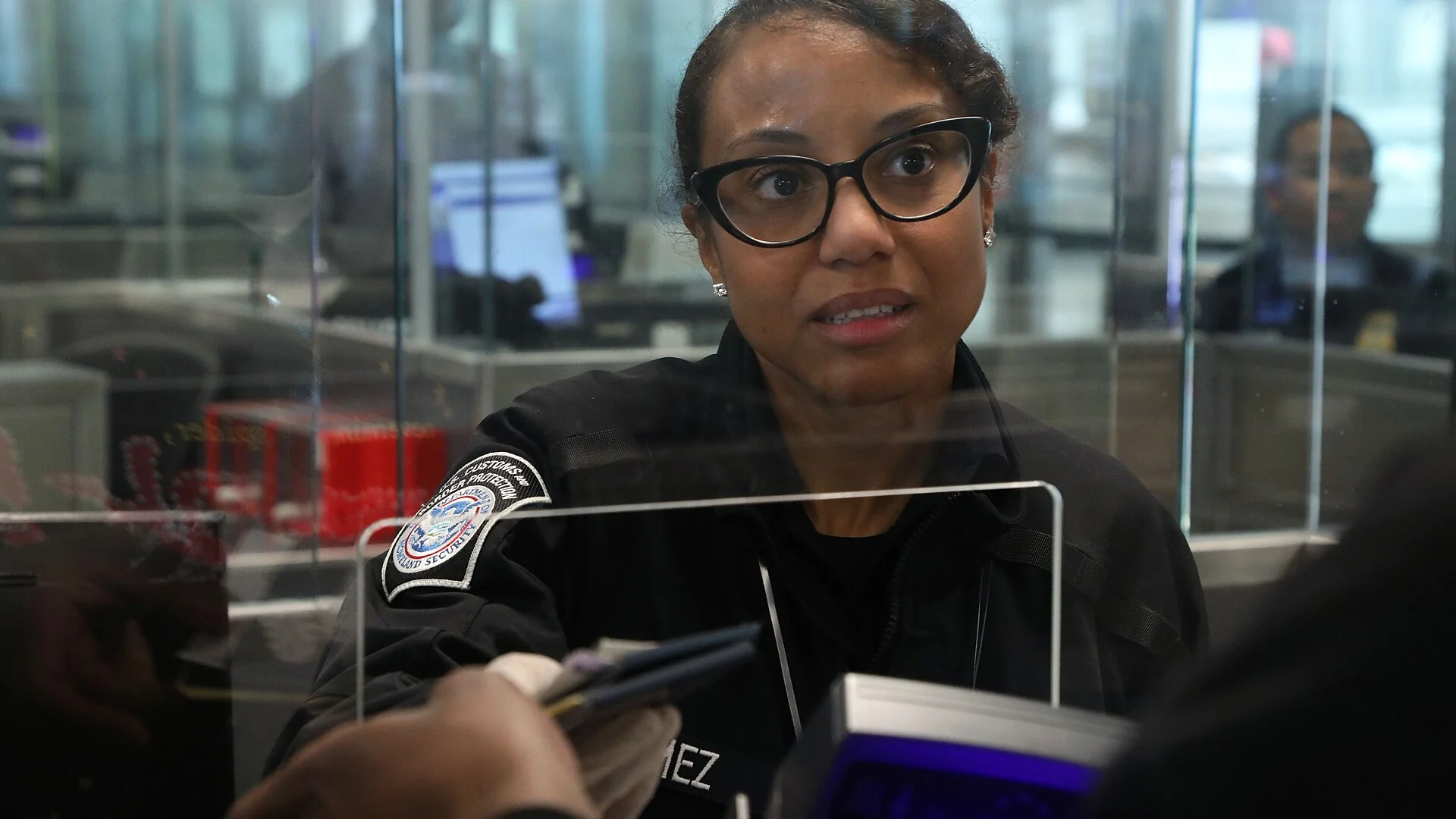 U.S. Customs and Border Protection officer processing arriving passengers at Dulles International Airport