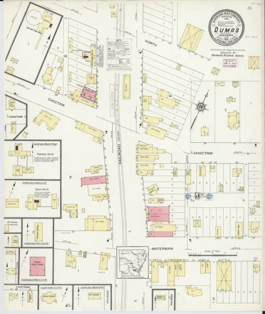Hand-colored 1913 fire insurance map index sheet for Dumas, showing the street grid and the railroad running through town, with colored blocks marking buildings and a round title seal at the top.