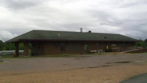 The historic Cotton Belt Railroad Depot in Fordyce, Arkansas, under a cloudy sky