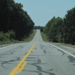 Two-lane Arkansas Highway 365 stretching through pine woods near White Hall in Jefferson County.