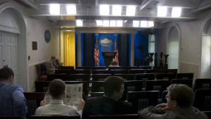 Empty seats and podium in the James S. Brady Press Briefing Room at the White House