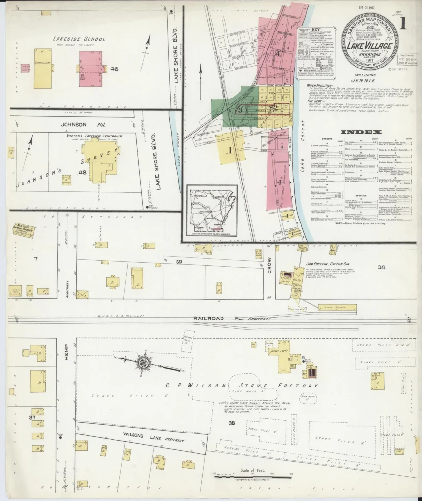 Hand-colored 1917 fire insurance map title sheet for Lake Village, with a round title seal, a small color-coded key map of the map sheets covering town, a printed index, and blocks of outlying buildings below.