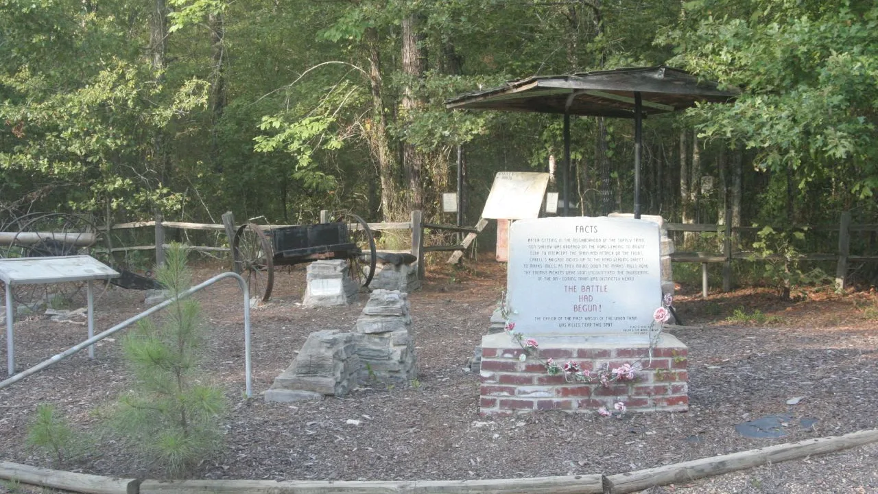 A small stone marker and display at the Marks' Mills battlefield site in Cleveland County, Arkansas.