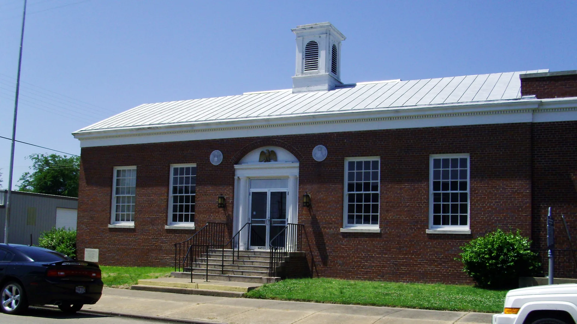 The McGehee Post Office, a red-brick building with a white cupola.
