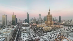 Warsaw skyline with high-rise buildings under a blue sky