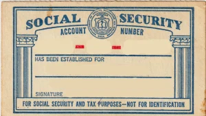 Front of a 1961-version Social Security account number card with the name and number blanked out.