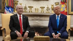 Israeli Prime Minister Benjamin Netanyahu and President Donald Trump sit side by side in the Oval Office in front of a fireplace