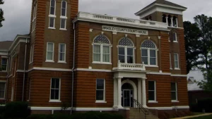 Front of the Bradley County Courthouse in Warren, Arkansas, with arched windows and a columned entrance
