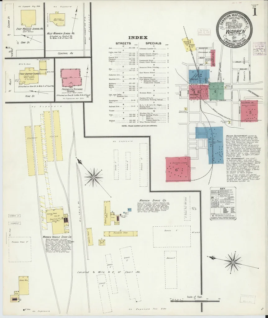 Hand-colored 1907 fire insurance index map of Warren showing the street grid and rail lines, with colored blocks marking larger buildings and printed notes and a street index on the sheet.