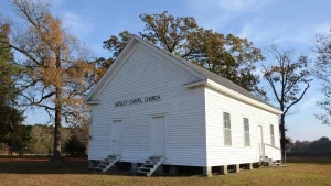 Wesley Chapel, a small white frame church with a gabled roof, in Woodlawn in Cleveland County, Arkansas.