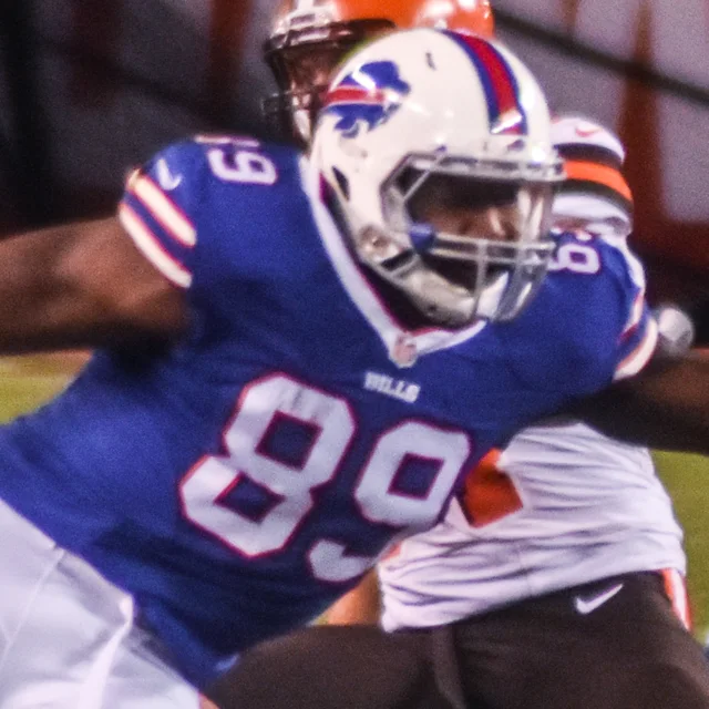 Chris Gragg in a football helmet and jersey on the field in 2015.