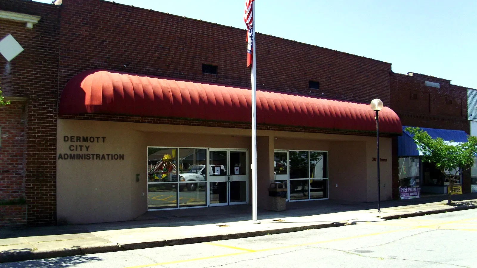 The Dermott, Arkansas, city administration building, a brick building with a red awning and a DERMOTT CITY ADMINISTRATION sign.