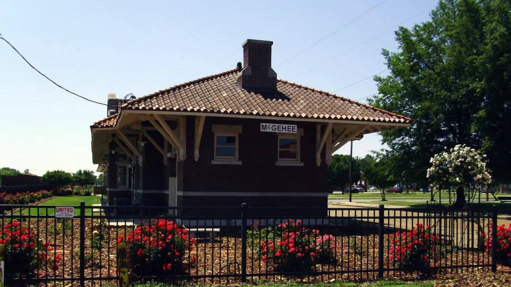 The historic brick train station in McGehee, Arkansas, with its wide overhanging roof.