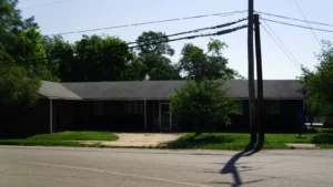 The Monticello branch of the Southeast Arkansas Regional Library, a modern one-story building among trees.