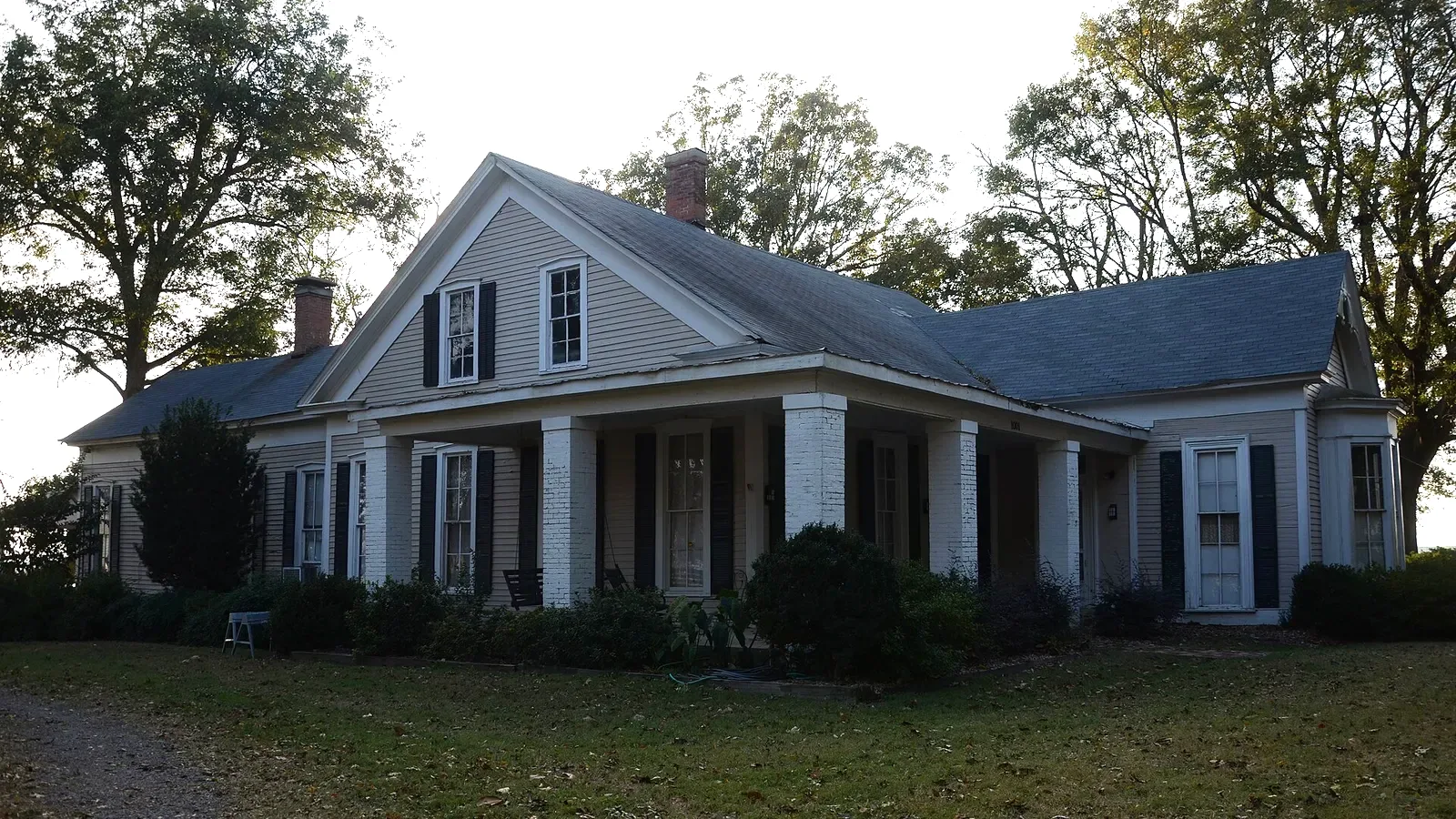 Roselawn, a large white two-story house with a front porch in Altheimer, Arkansas.