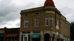 A two-story red-brick commercial building on a corner in downtown Fordyce, Arkansas.