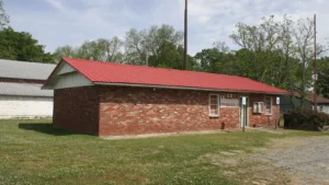 Tillar City Hall in Drew County, Arkansas, a one-story red-brick building with a gabled roof.