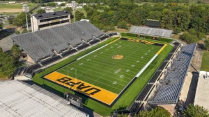 Aerial view of Simmons Bank Field at Golden Lion Stadium in Pine Bluff, Arkansas, with UAPB painted at midfield.